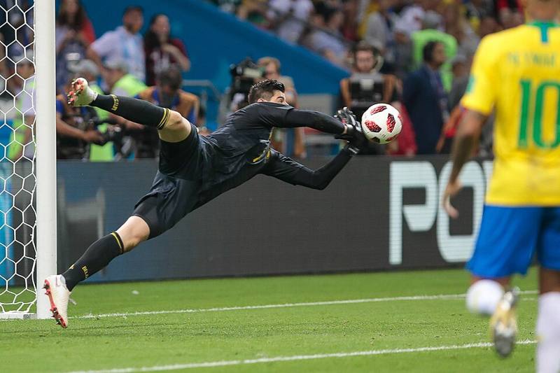 A goalkeeper diving to make a save