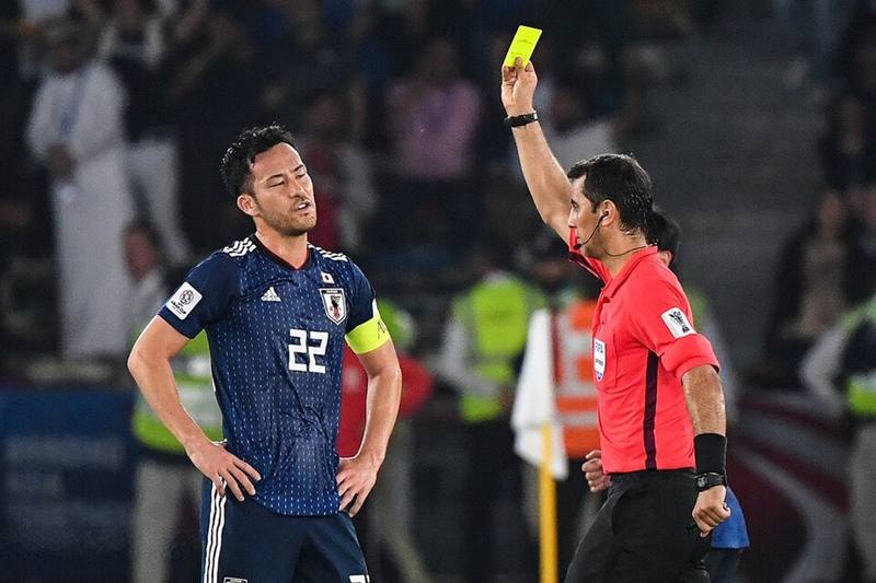 Referee holding up a card